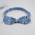 Blue paisley print knot headband with bunny ear wire style on white background - Sky Blue Paisley