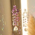 Golden flower sun catcher with purple crystals and rainbow light refraction - Colorful Wreath