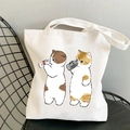 White canvas tote bag featuring cute cat print with milk bottle on a metal chair - Cat with Milk