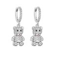Macro shot of silver paved teddy bear earrings with pink nose and zircon detailing - Silver Bear