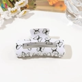 Detailed close-up of a rectangular hair claw clip with black butterfly print on white - 8cm Square / Light Grey Butterfly