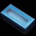 Macro shot of rectangular blue glitter eyelash box featuring a clear top window display - Blue