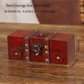Vintage red wooden storage box with faux distressed finish and metal buckle detail - Round Retro Red