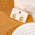 Balloon-style gold letter G stud earrings in 18k plated stainless steel finish - Letter G