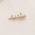 Detailed close-up of golden alloy hair clip with white pearls and sparkling rhinestones - Lightning Style