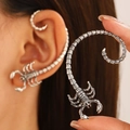 Macro shot of punk scorpion earrings with vintage texture and detailed metal design - Scorpion Ear Wraps Pair (X479)