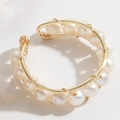 Beaded ring featuring 14K gold plated wire with row of natural white pearls - Freshwater Pearl