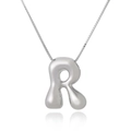 Polished silver 3D letter R pendant on a thin box chain with a soft shadow reflection - Letter R