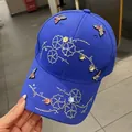 Royal blue baseball cap with colorful rhinestone butterfly and floral sequins - Adult One Size (Adjustable) / Royal Blue