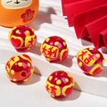 Close-up of red beads with lucky Chinese characters and festive New Year decorations - Good Luck + Heart / Red