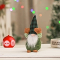 Close-up of a festive Christmas gnome doll with a green plaid hat covering its eyes - Green