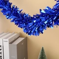 Close-up of deep blue shimmering tinsel garland hanging in a festive indoor setting - 9cm*2m / Dark Blue