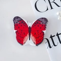 Support de téléphone papillon rouge et noir avec finition brillante et base en métal - Motif Rouge Noir Blanc