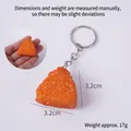 Orange realistic triangular sushi rice ball keychain pendant made of textured resin - Golden Triangle Rice Ball With Keychain