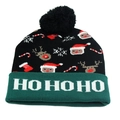 Close-up of knit Christmas beanie with HO HO HO text on the green cuff and pom-pom - One Size / Black HO HO HO (LED)