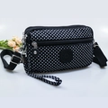 Black crossbody phone bag with white polka dots featuring three zip compartments and strap - Black with Polka Dots
