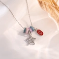 Macro detail of silver bead necklace with star charm and red lucky fortune pendant - Silver Lucky Star Style