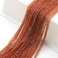 Macro shot of 2mm amber faceted glass beads neatly arranged for jewelry making - Wine Red Plated