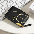 Black leather bear card holder with gold zipper and lovely text on a white desk - 9 Card Slots / Black