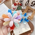 Rainbow plush flower brooch with pearls and metal pin back in a cozy festive setting - Multicolor Fireworks Brooch / One Size