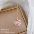 Detail view of a gold heart pendant with pink crystal and stones including size parameters - Pink Heart Pendant Style (A230)