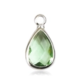 Detailed close-up of a green birthstone pendant with faceted glass and silver frame - Silver - August