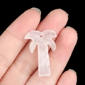 Pink quartz natural crystal coconut tree pendant held by hand against black background - White Crystal