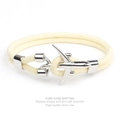 Close-up of beige milan rope bracelet featuring a silver aircraft charm and braided texture - Cream Rope Silver Airplane