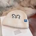 Cream knit beanie featuring a small bear embroidery and stylish blue lettered woven label - Bear Embroidered Style / White
