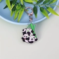 Porte-clés en acrylique avec pandas empilés et bambou, muni d'un fermoir mousqueton argenté - Pandas Empilés