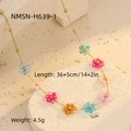 Detailed macro view of gold necklace with colorful crystal flowers and size parameters - Gold Blue Pink Crystal Flower (NMSN-H639-1)