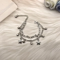 Elegant silver layered bracelet with star charms and bells on a soft plush background - Double Layer Pentagram Bell Style / Silver