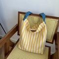 Detail of the blue ruched handle contrast on the yellow and white striped knit tote bag - Yellow Strap