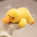 Adorable yellow plush duckling doll with soft long fur and cute orange beak - Duck
