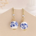 Elegant porcelain drop earrings with blue floral beads and long tassels in gold - Short Style