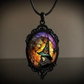 Detailed shot of a gothic witch pendant necklace with orange moon and purple night sky - 30*40 Witch 02
