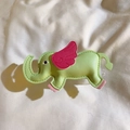 Detail of a green leather elephant accessory with pink wings and fine stitching detail - Back Clip Only / Green