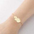 Minimalist golden feather charm bracelet with fine engraved details on a cross chain - 356-Feather