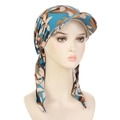 Detail of blue and brown camo turban hat with a stylish brim on a mannequin head - Blue Beige Flowers