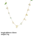 Detailed shot of 18k gold chain with natural green and yellow gemstones on white background - Gold - Natural Stone Style Necklace (TN3290)