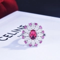 Macro detail of a 2ct oval red sapphire ring with pink floral petals and silver band - Red Zirconia / Adjustable Open