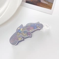 Detail shot of a purple acrylic banana hair clip with iridescent geometric patterns - Light Gray