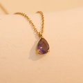 Golden teardrop pendant necklace featuring a purple gemstone in a 4-prong setting - April (Purple)