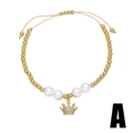 Gold-plated beaded bracelet with pearls, crown charm and zircon inlay on white background - Crown Style (A)
