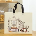 Beige non-woven shopping bag with European street art and black handles in home setting - Horizontal 27*32*10cm / European Scenery