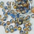 Macro detail of 10mm blue and gold crackle glass beads for DIY jewelry making - Sky Blue Mix