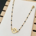 Bohemian gold chain bracelet with black beads and a hollow paw print pendant charm - Black