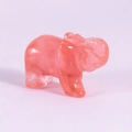 Polished 1.5-inch pink crystal elephant figurine with translucent finish on textured background - Watermelon red
