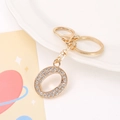 Detail of gold letter O keychain with white rhinestones and secure rotating lobster clasp - Letter O