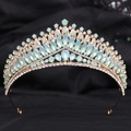 Macro detail of golden bridal tiara featuring light blue opal-style gems and white crystals - H1378 KC Gold + Green Opal